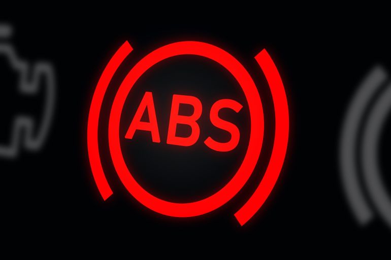 Anti-lock Braking System (ABS) warning light on a car dashboard, displayed on a digital background. 3D rendering of the safety warning indicator