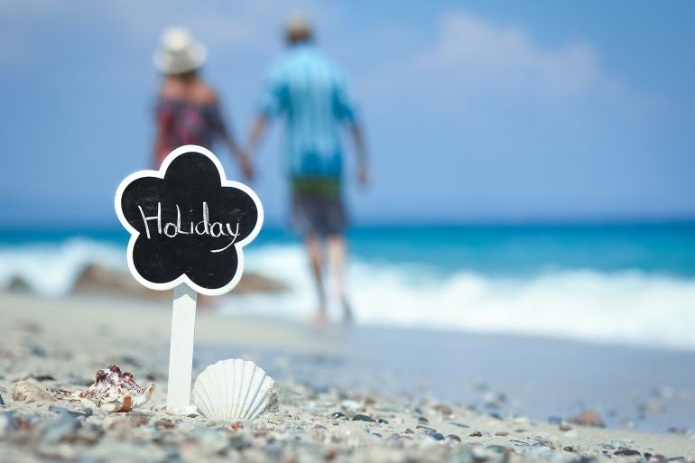 Happy couple at the seaside vacation travel weekend