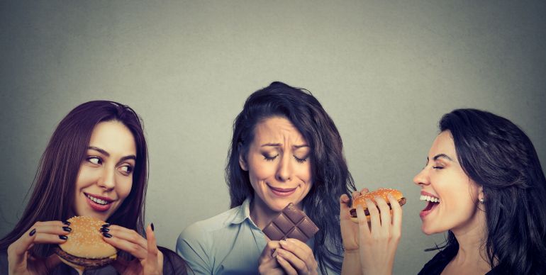 Portrait of a three women craving fats food and sweets