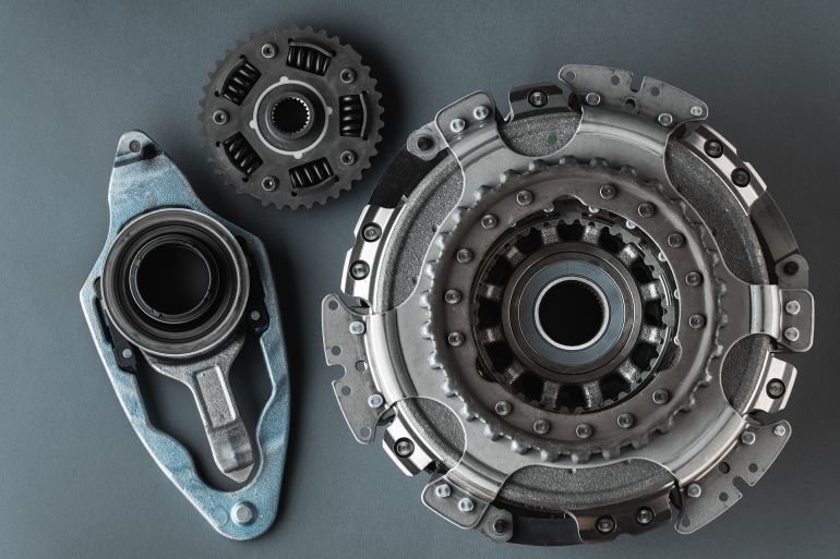 New clutch kit of the automatic gearbox DSG prepared to replace. Spare parts for a modern car isolated on grey background. Car repair and service concept; Shutterstock ID 2568703689; purchase_order: aj; job: ; client: ; other: