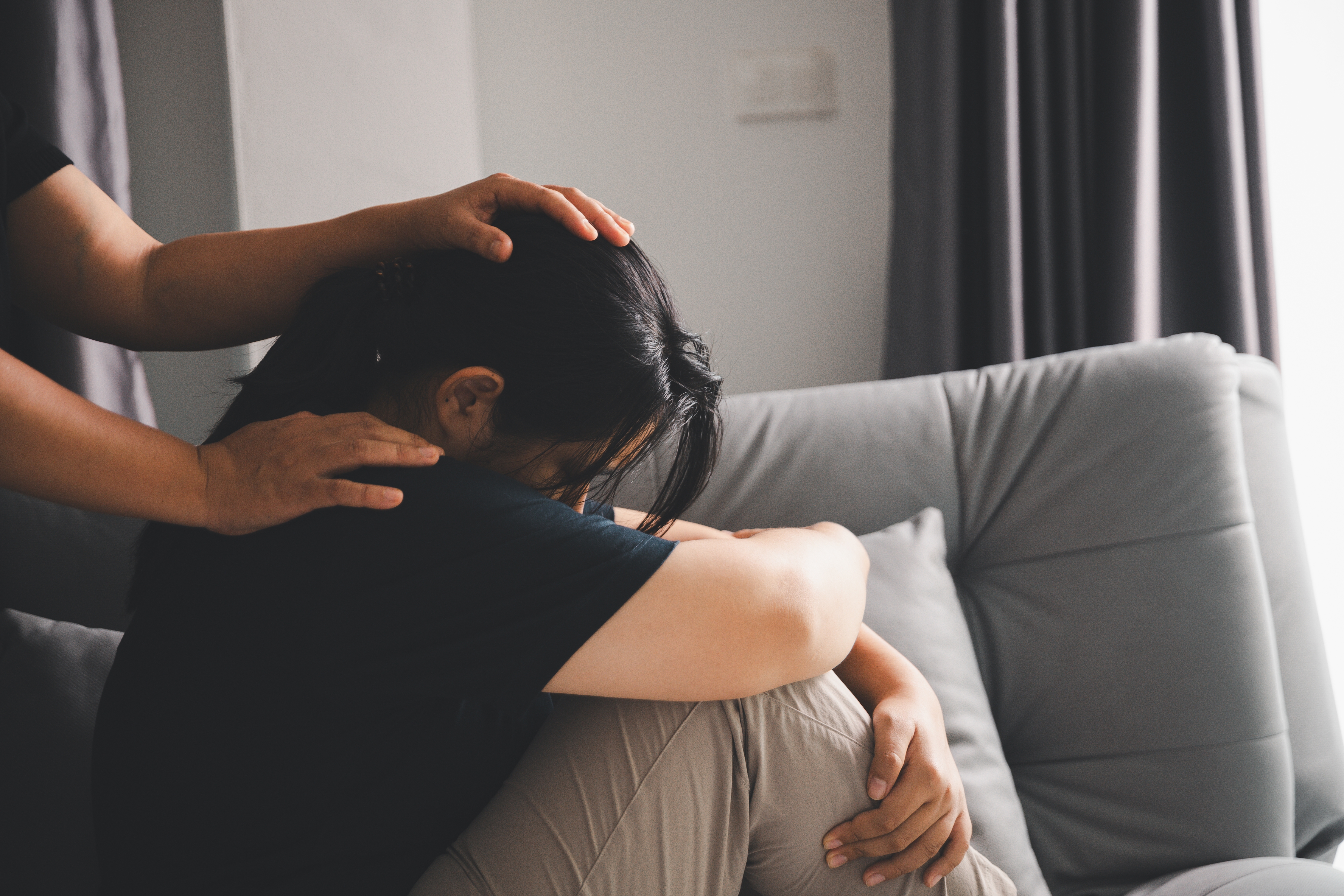 Hope and trust with crisis concept. Closeup, love and holding hands for support, comfort and care with grief, loss and empathy. people and family with compassion, sympathy and healing with bonding.