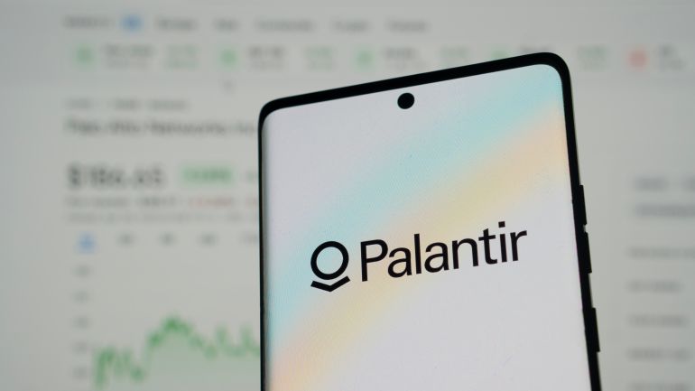 Dhaka, Bangladesh 24 May 2025:Palantir logo on smartphone with blurred financial data in the background.