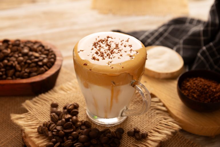 Dalgona Coffee, a cold, sweetened whipped beverage made with milk and frothy coffee cream made with instant coffee, a trendy, refreshing, and easy recipe.