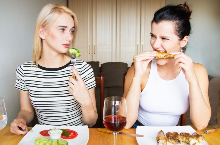 Vegan and meat-eaters friends lunch together