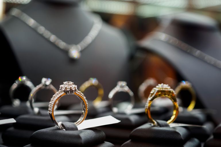 Jewelry diamond rings and necklaces show in luxury retail store window display showcase