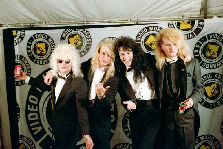 Rock band Poison poses at the MTV Video Music Awards in Los Angeles, Ca., Sept. 11, 1987. From left to right are, C.C. Deville, Bret Michaels, Bobby Dall and Rikki Rockett. (AP Photo/Lennox McLendon)