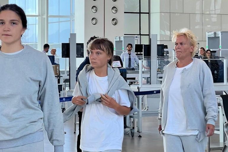 3587633-1759756256 Swedish activist Greta Thunberg (c) at Ramon International Airport on October 6, 2025, before being deported along with other Gaza flotilla activists. (Foreign Ministry)
