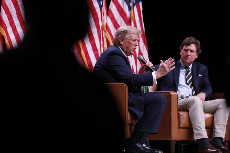 PHOENIX, ARIZONA - OCTOBER 31: Republican presidential nominee, former President Donald Trump sits down for a conversation with Tucker Carlson during his Live Tour at the Desert Diamond Arena on October 31, 2024 in Phoenix, Arizona. With less than a week until Election Day, Trump is campaigning for re-election in New Mexico and the battleground states of Nevada and Arizona on Thursday. (Photo by Chip Somodevilla/Getty Images)