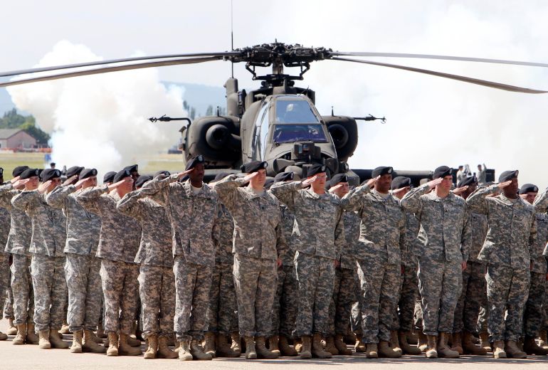 قوات أمريكية في ألمانيا FILE - In this Friday, May 13, 2011 file photo, Soldiers of 1AD attend a color casing ceremony of the First Armored Division at the US Army Airfield in Wiesbaden, Germany. Germany's Defense Ministry says U.S. Secretary of Defense Lloyd Austin told Defense Minister Annegret Kramp-Karrenbauer in his first conversation with her since taking up his new post that Germany is “highly valued” as a station for American soldiers. (AP Photo/Michael Probst, File)