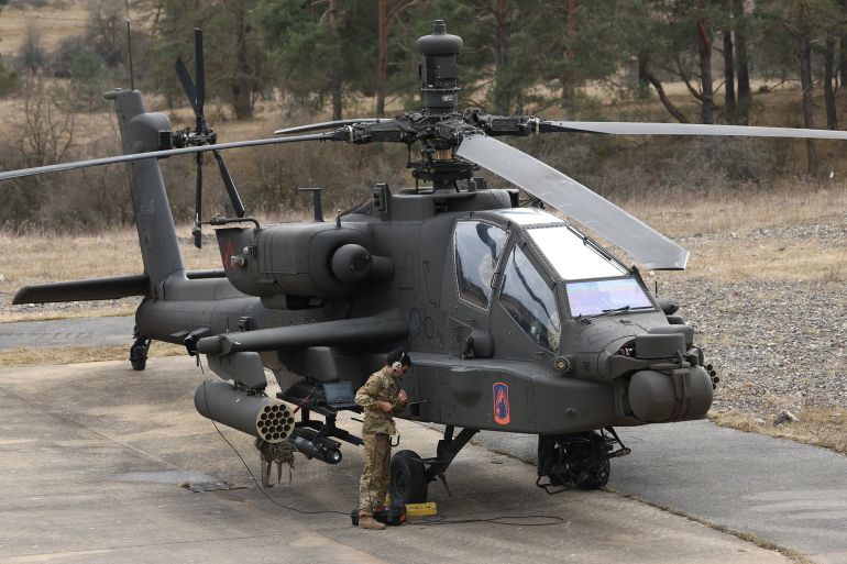 HOHENFELS, GERMANY - MARCH 12: A crew member readies a Boeing AH-64 Apache attack helicopter of the U.S. Army 12th Combat Aviation Brigade during the Allied Spirit 25 military exercise at the U.S. 7th Army Training Command Joint Multinational Readiness Center on March 12, 2025 near Hohenfels, Germany. Approximately 3,000 troops from NATO member countries, including the United States, Austria, the Czech Republic, France, Hungary, Italy, Spain, Latvia, Lithuania, North Macedonia, Slovakia, Slovenia and the United Kingdom, are participating in the four-week exercise with the aim of improving interoperability. European countries have pledged large-scale defence spending following doubts cast by the administration of U.S. President Donald Trump on the future of the U.S. commitment to the NATO military alliance. (Photo by Sean Gallup/Getty Images)