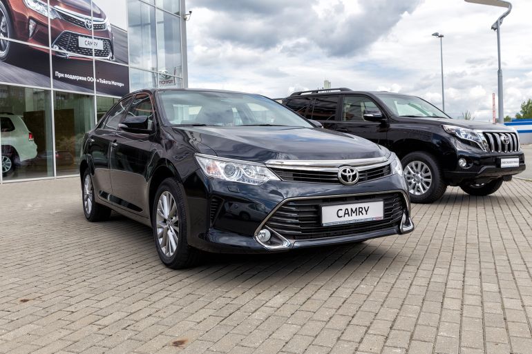 5etf-1773397161 Nizhny Tagil, Russia - June 07, 2017: Toyota Camry in front of the motor show