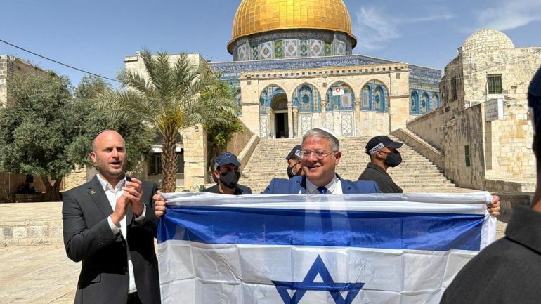 Israeli National Security Minister Itamar Ben-Gvir holds an Israeli flag at the Al-Aqsa compound, known to Jews as the Temple Mount, on Jerusalem Day, in Jerusalem's Old City, May 14, 2026. Itamar Ben Gvir's Office/Handout via REUTERS THIS IMAGE HAS BEEN SUPPLIED BY A THIRD PARTY. NO RESALES. NO ARCHIVES. MANDATORY CREDIT.