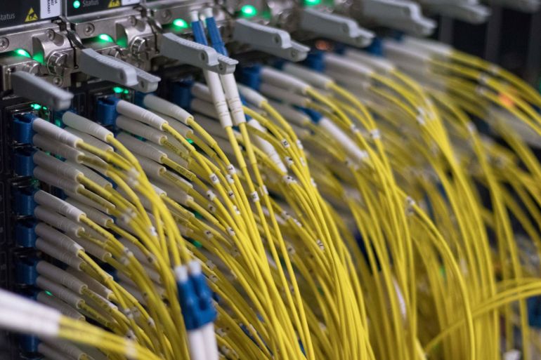 A picture taken on July 25, 2018 shows cables on servers at a data center of the internet exchange point DE-CIX (Deutscher Commercial Internet Exchange) in Frankfurt am Main, western Germany. (Photo by Yann Schreiber / AFP) (Photo by YANN SCHREIBER/AFP via Getty Images)