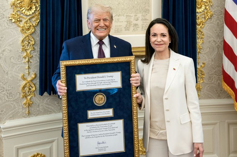 U.S. President Trump meets with Venezuelan opposition leader Maria Corina Machado in the Oval Office, during which she presented the President with her Nobel Peace Prize, in Washington, D.C, U.S., released January 15, 2026. Daniel Torok/The White House/Handout via REUTERS THIS IMAGE HAS BEEN SUPPLIED BY A THIRD PARTY TPX IMAGES OF THE DAY