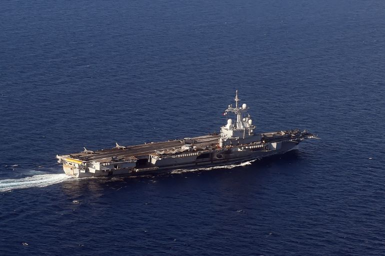 An aerian view shows the Charles-de-Gaulle aircraft carrier on November 22, 2015 in the eastern Mediterranean Sea.