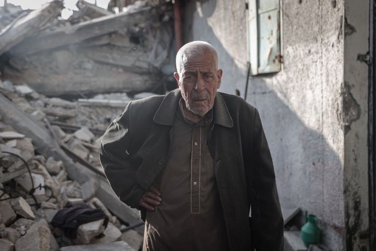 Despite everything, Abdel Mahdi al-Wuheidi is happy to be back at his home in Gaza’s Jabalia [Abdelhakim Abu Riash/Al Jazeera]