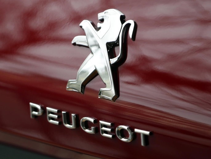 The Peugeot logo is seen on a car displayed at the headquarters of French carmaker PSA Peugeot Citroen in Paris, France, February 24, 2016. REUTERS/Charles Platiau