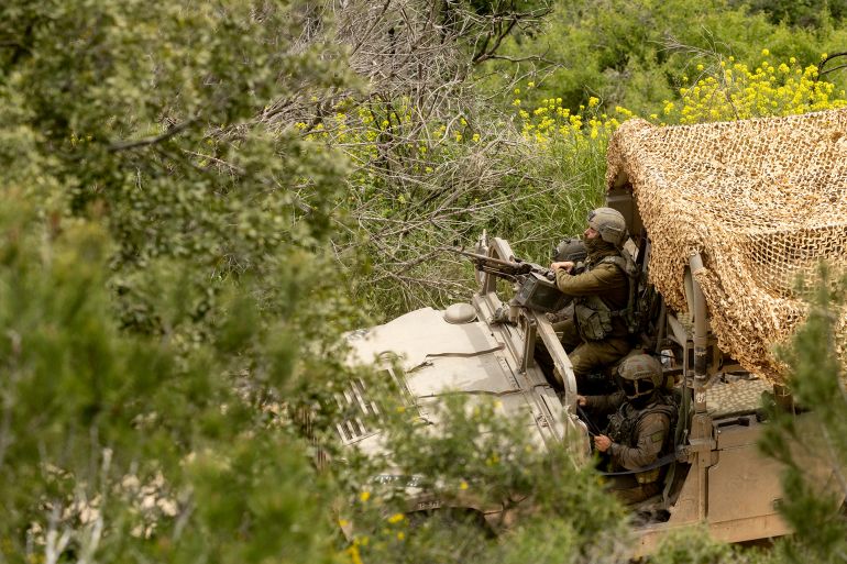 NORTHERN ISRAEL, ISRAEL, - APRIL 15: An Israeli soldier sits in an army vehicle as it mover near the border with Lebanon, as seen from a position on the Israeli side of the border on April 15, 2026 in Northern Israel, Israel. Israel and Lebanon's ambassadors have held historic talks in Washington, the first direct diplomatic meeting between the two sides in decades. During the two-week ceasefire period between the US and Iran, Israel and the Iran-backed militant group, Hezbollah, have continued fighting. On April 8 Israel intensified strikes on what it says were Hezbollah targets, killing more than 350 people, according to health officials in Lebanon. (Photo by Amir Levy/Getty Images)