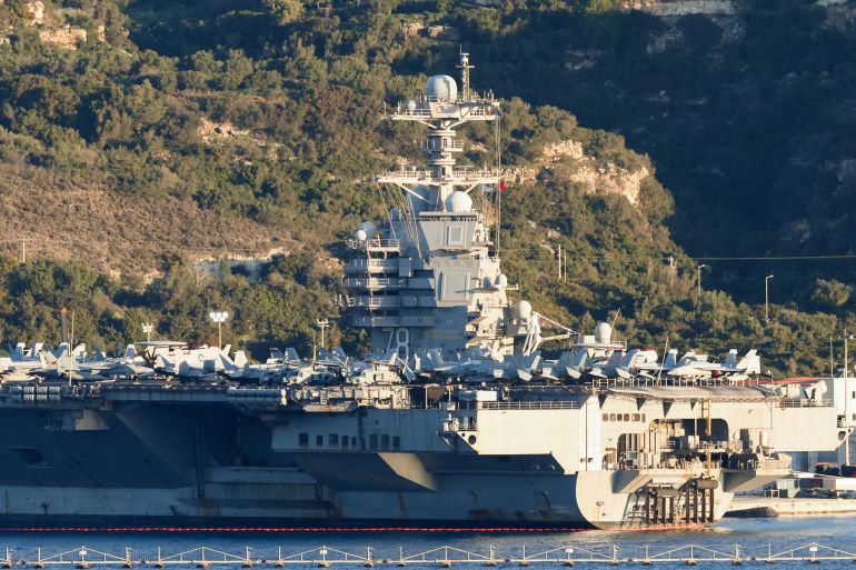 afp_699deb7c8925-1771957116 US aircraft carrier USS Gerald Ford is pictured docked at Souda Bay in the Greek Mediterranean island of Crete, on February 24, 2026.