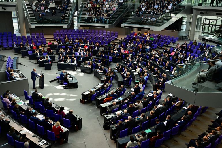 German Chancellor Friedrich Merz addresses delegates during a session at the Bundestag (lower house of parliament) in Berlin on March 18, 2026, ahead of a summit of the European Union. (Photo by John MACDOUGALL / AFP)