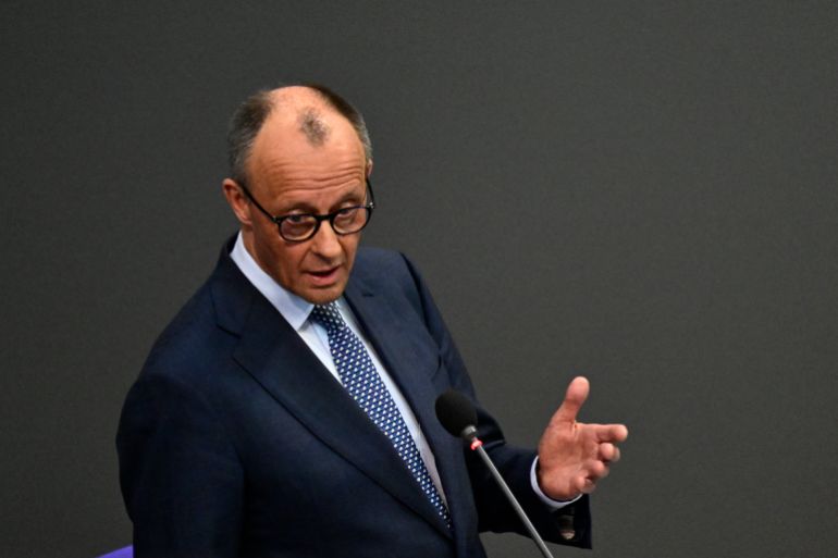 afp_69c6bb6e0dfd-1774631790 German Chancellor Friedrich Merz answers questions from parliamentarians to the government during a question time at the Bundestag (lower house of parliament) in Berlin, on March 25, 2026. (Photo by John MACDOUGALL / AFP)
