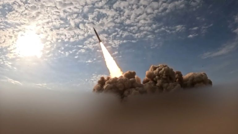 TOPSHOT - This video grab taken from images released by the Iranian state broadcaster (IRIB) on March 26, 2026, shows what it says is the second phase of the 82nd wave of missiles launched against Israel and US bases in the United Arab Emirates and Kuwait.
