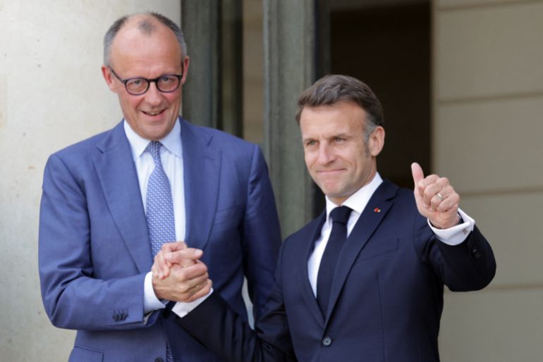 France's President Emmanuel Macron (R) welcomes German chancellor Friedrich Merz ahead of a meeting of allies to consider sending a multinational force to ensure security and free-flowing trade in the Strait of Hormuz, at the presidential Elysee Palace in Paris on April 17, 2026.