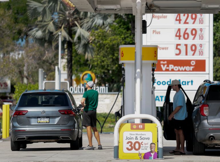 afp_69e233aa96b5-1776432042 MIAMI, FLORIDA - APRIL 13: Fuel prices are displayed on a sign as customers fill their vehicles at a gas station on April 13, 2026 in Miami, Florida. As the United States military blockades the Strait of Hormuz fuel prices rose above $100 dollars a barrel. Joe Raedle/Getty Images/AFP (Photo by JOE RAEDLE / GETTY IMAGES NORTH AMERICA / Getty Images via AFP)