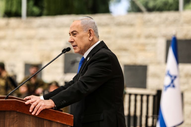 afp_69eea3cc902c-1777247180 Israel’s Prime Minister Benjamin Netanyahu speaks during a ceremony commemorating Israel’s Remembrance Day for fallen soldiers, or Yom HaZikaron, at the Military Cemetery on Mount Herzl in Jerusalem on April 21, 2026.