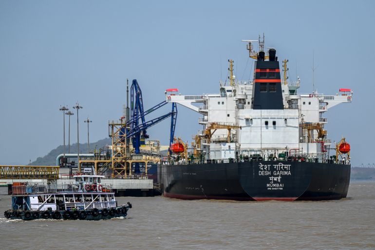 afp_69f4857c6388-1777632636 Desh Garima, an Indian-flagged tanker carrying crude oil that transited through the Strait of Hormuz, is seen docked at an offloading terminal along the coast in Mumbai on April 30, 2026.