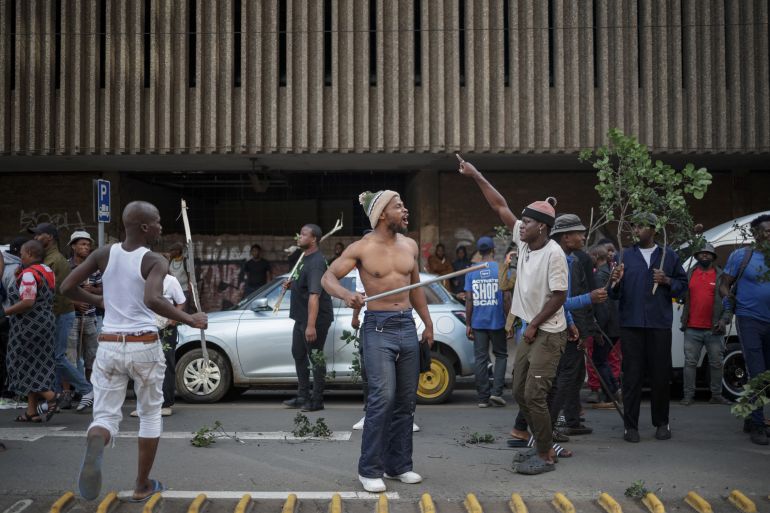 afp_69f7180ad323-1777801226 Protestors gesture in the street during a protest march against undocumented migrants organised by “March and March” in Johannesburg on April 29, 2026. (Photo by EMMANUEL CROSET / AFP)