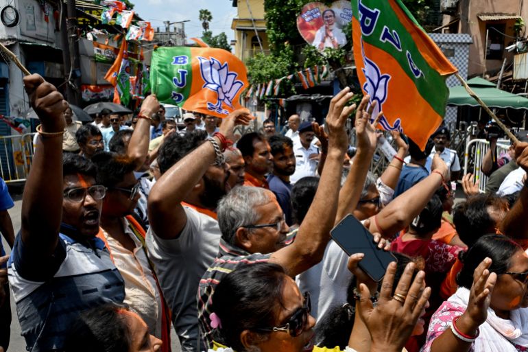 Bharatiya Janata Party (BJP) supporters celebrate along a street near her residence of West Bengal chief minister and All India Trinamool Congress (TMC) party chairperson Mamata Banerjee, in Kolkata on May 4, 2026 during vote counting for the West Bengal Legislative Assembly elections.