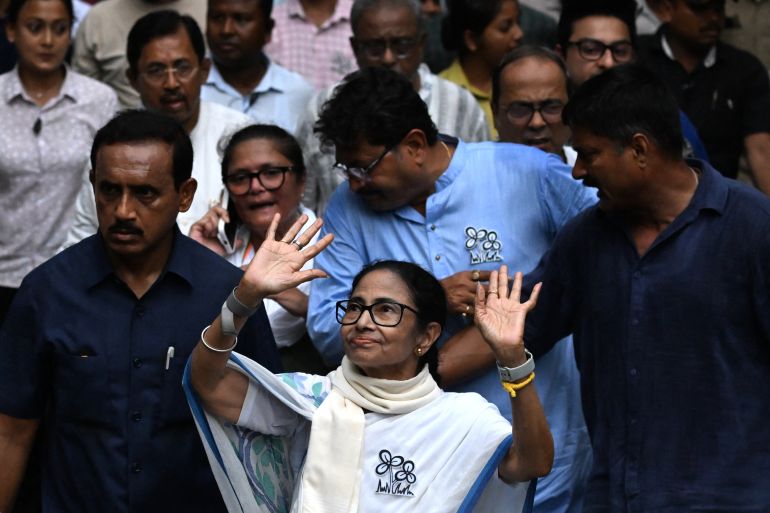 afp_69f98b6f541b-1777961839 Chief Minister of West Bengal and Chairperson of All India Trinamool Congress, Mamata Banerjee (C), greets her supporters during a rally ahead of the second phase of the legislative assembly elections in Kolkata on April 27, 2026. (Photo by Dibyangshu SARKAR / AFP)