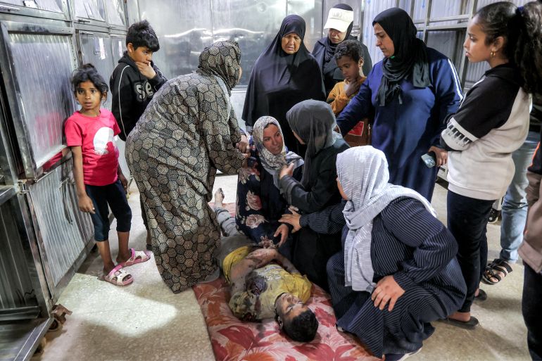 EDITORS NOTE: Graphic content / Relatives mourn over the body of Palestinian child Mahmoud Sahwil, 14, who was killed during an Israeli strike on a police station in the Sheikh Radwan neighbourhood, as the body lies at the morgue at Shifa Hospital in Gaza City on May 5, 2026.