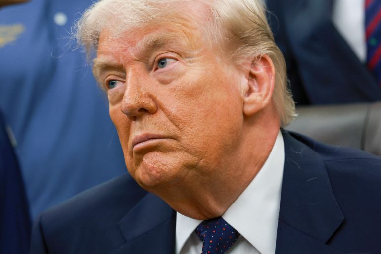 WASHINGTON, DC - MAY 05: U.S. President Donald Trump looks on during a proclamation signing in the Oval Office of the White House on May 05, 2026 in Washington, DC. President Trump signed a presidential memorandum restoring the Presidential Fitness Test Award, which was reinstated by executive order in July 2025 and reintroduces a performance-based benchmark in physical education. Anna Moneymaker/Getty Images/AFP (Photo by Anna Moneymaker / GETTY IMAGES NORTH AMERICA / Getty Images via AFP)
