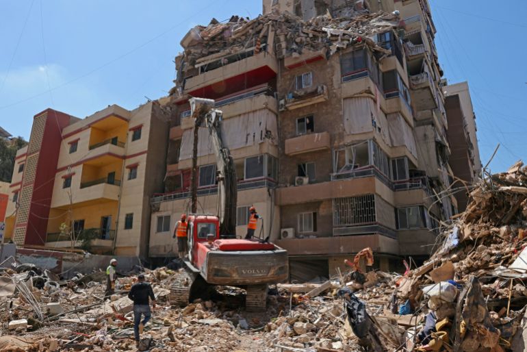 afp_69fc5c7514ed-1778146421 First responders inspect the rubble of a collapsed building following an Israeli airstrike a day earlier in Beirut’s southern suburb of Haret Hreik on May 7, 2026.