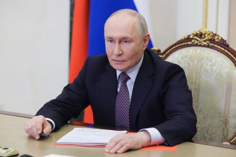 In this pool photograph distributed by the Russian state agency Sputnik, Russia's President Vladimir Putin chairs a Security Council meeting via videolink in Moscow on May 8, 2026. (Photo by Mikhail METZEL / POOL / AFP)