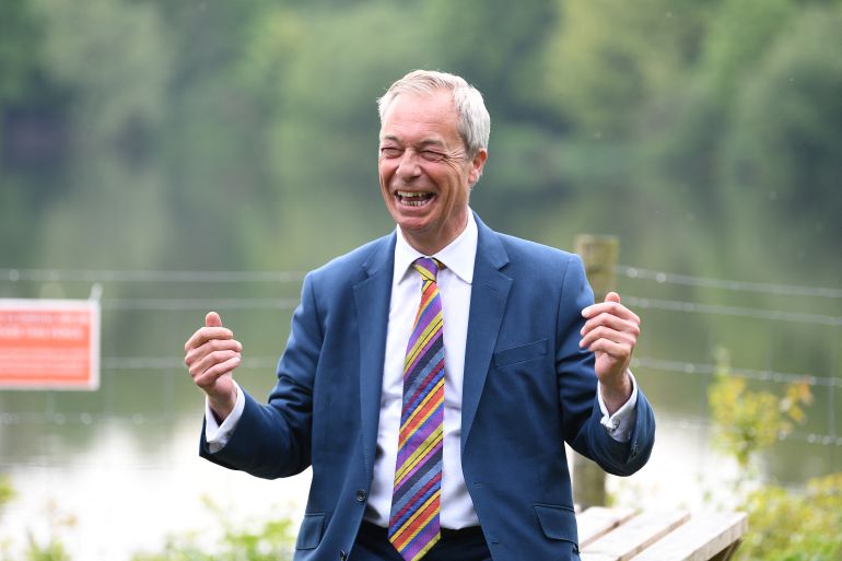Reform UK leader Nigel Farage reacts during a visit to St Helens, north west England on May 8, 2026, as votes continue to be counted following local elections.