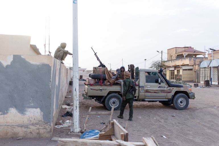 afp_69ffb1311f02-1778364721-1 TOPSHOT - Soldiers from the National Front for the Liberation of Azawad (FLA) stand near a pick-up truck as they patrol the streets of Kidal, on May 8, 2026.