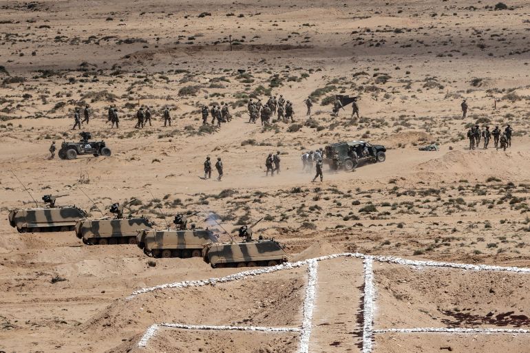 afp_6a05207ebea5-1778720894 Troops and armoured vehicles take part in the "African Lion" joint military exercise between US and Moroccan forces in the Tan-Tan region in southwestern Morocco on May 8, 2026. (Photo by Abdel Majid BZIOUAT / AFP)
