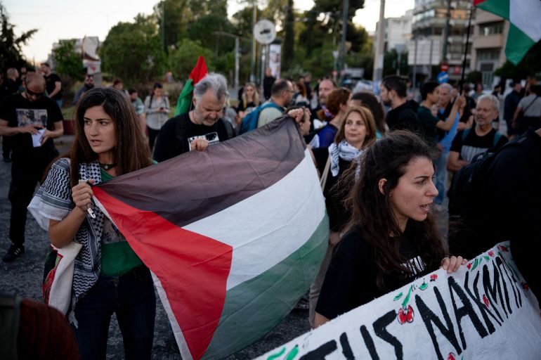 Protestors hold Palestinian flags and chant outside the Israeli embassy during a demonstration marking the 78th anniversary of Nakba in Athens on May 15, 2026. (Photo by Aggelos NAKKAS / AFP)