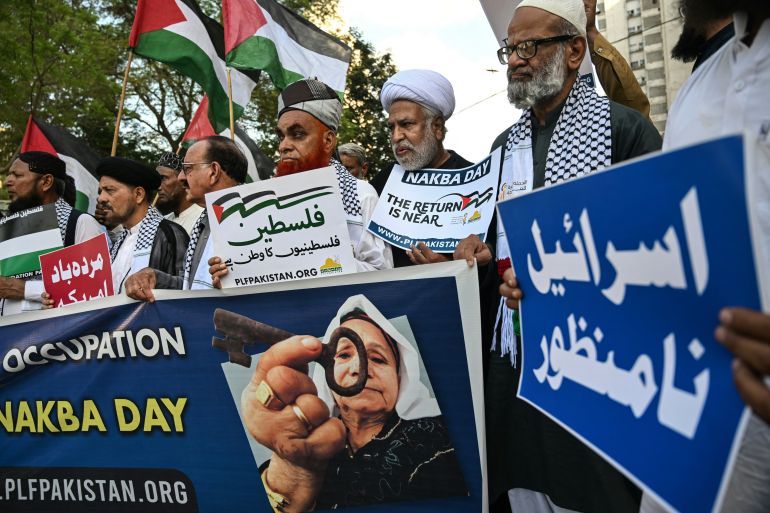 Shiite Muslims holding placards take part in an anti-Israel protest to show their solidarity with Palestinians amid the ongoing conflict, in Karachi on May 15, 2026. (Photo by Rizwan TABASSUM / AFP)