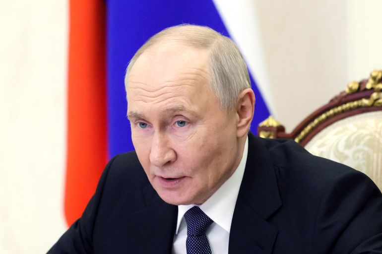 afp_6a0bab9f8934-1779149727 In this pool photograph distributed by the Russian state agency Sputnik, Russia's President Vladimir Putin chairs a Security Council meeting via videolink in Moscow on May 18, 2026. (Photo by Mikhail METZEL / POOL / AFP)