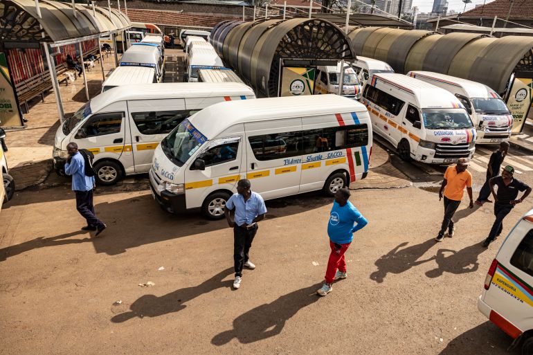 afp_6a0c23487fbf-1779180360 Public transport buses (locally known as matatu) crews pass the time chatting, amidst their grounded mini-buses due to a nationwide strike by transporters now in it's second day over fuel price hikes in Nairobi on May 19, 2026.