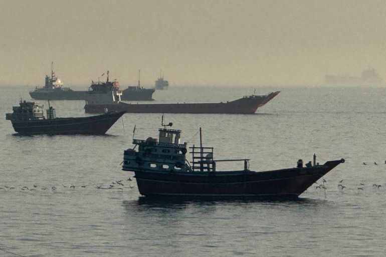 afp_6a0d561f5e0d-1779258911-1 Vessels are seen anchored in the Strait of Hormuz, off the port city of Khasab on Oman’s northern Musandam Peninsula on May 17, 2026.