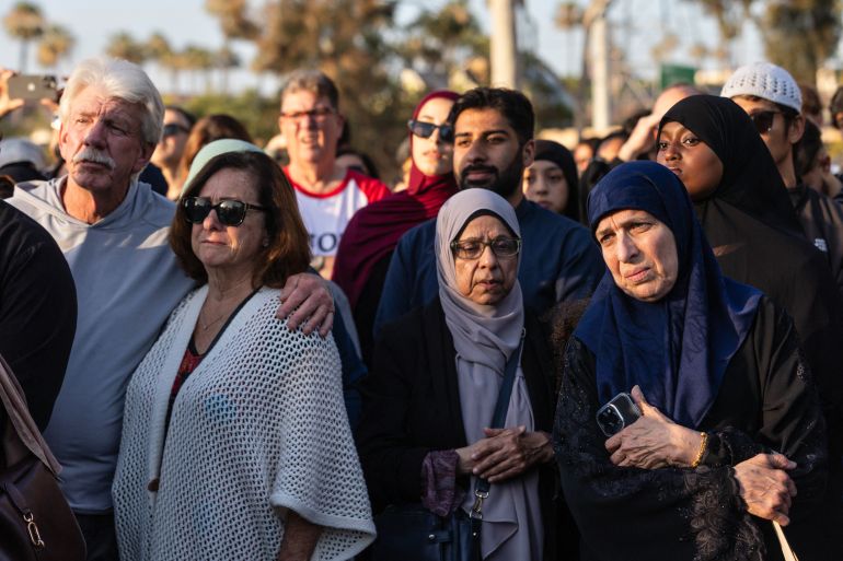 afp_6a0d9e3643c3-1779277366 Community members gather at a vigil for victims and families of a shooting at the Islamic Center of San Diego, California, on May 19, 2026, a day after the attack.