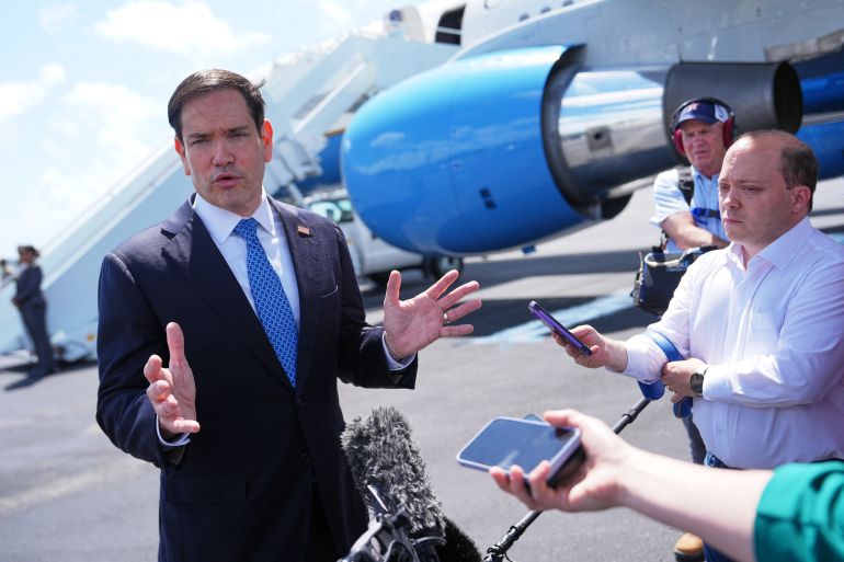 afp_6a0f2522eca3-1779377442 US Secretary of State Marco Rubio speaks to the press before boarding his plane at Homestead Air Reserve Base on May 21, 2026 in Homestead, Florida.