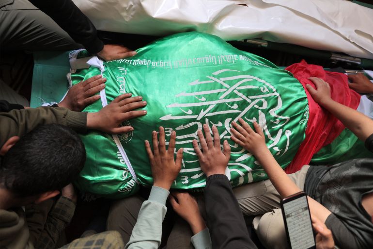 afp_6a0f4dfd39f4-1779387901 EDITORS NOTE: Graphic content / Mourners bid farewell to the body of Ezzedine Al-Haddad, the slain chief of the Qassam Brigades -- the armed wing of Palestinian movement Hamas, who was killed in an overnight Israeli strike along with family members, during the funeral in Gaza City on May 16, 2026.
