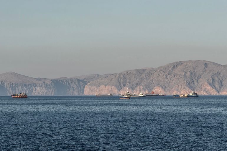 Vessels are seen anchored in the Strait of Hormuz, off the port city of Khasab on Oman’s northern Musandam Peninsula on May 17, 2026.