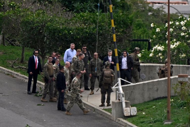 US Southern Command chief Gen. Francis Donovan (8-R), head of the US diplomatic mission in Venezuela John Barrett (4-R), and other officials take part in an air evacuation drill at the US Embassy, in Caracas, on May 23, 2026. (Photo by Federico PARRA / AFP)